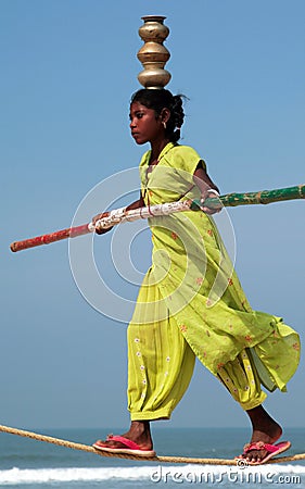 GOA, INDIA - FEB 12: Wandering indian tightrope walker Editorial Stock Photo