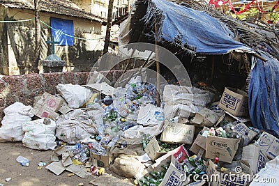 GOA, India - Large garbage dump waste of plastic bottles on the beach Editorial Stock Photo