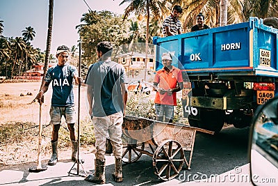 Goa, India. Workers Carry Out Repair On Road Editorial Stock Photo