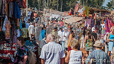 Goa, India - January 2008 - Tourists and local traders at the famous weekly flea market in Anjuna Editorial Stock Photo
