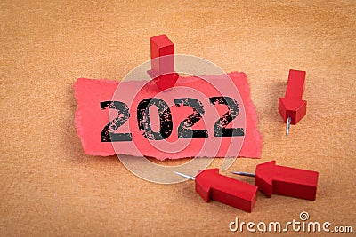 2022 goal. Business opportunities, education and medicine. sheet of paper and arrows on an orange background Stock Photo