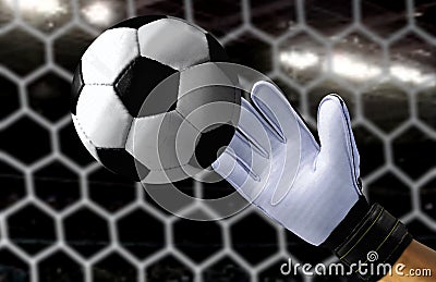 Goal keeper trying to catch a fast soccer ball Stock Photo