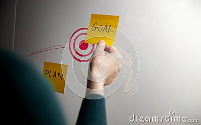 Goal, Plan, Challenge and Strategy Concept. Person making Business Plan on Sticky Note Stock Photo