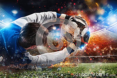 Goalkeeper catches a fast fiery soccer ball Stock Photo