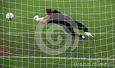 Goalkeeper diving save Stock Photo