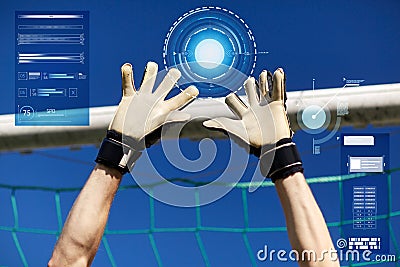 Goalkeeper or soccer player hands at football goal Stock Photo