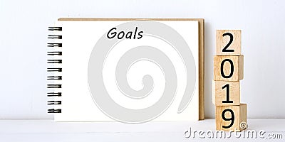 2019 goals on blank note paper background, new year aim to success in business background Stock Photo