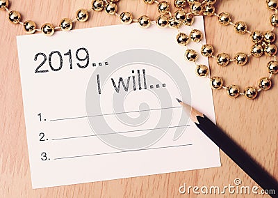 2019 goals list with gold decoration. We wish you a new year filled with wonder, peace, and meaning Stock Photo