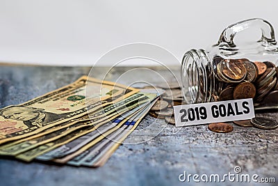 2019 goals motivational savings concept with coins in glass jar Stock Photo