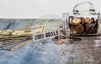 2019 goals motivational savings concept with coins in glass jar Stock Photo