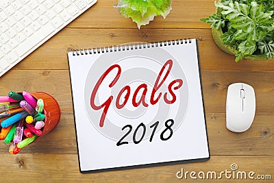 2018 goals on paper note book background on office table, business and new year concept Stock Photo