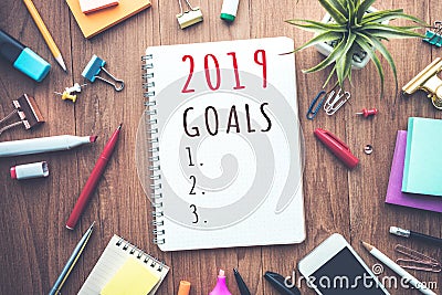 2019 goals text on notepad with office accessories.Business plan Stock Photo