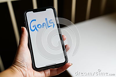 Goals text written on smart phone Stock Photo