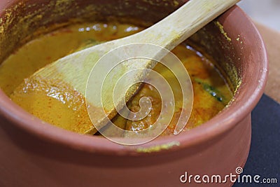 Goan Fish Curry In traditional clay pot Stock Photo