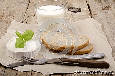 Goat cheese, bread and milk Stock Photo