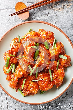Gobi Manchurian is an Indo-Chinese appetizer crispy and crunchy fried cauliflower coated in a sweet, tangy, umami chili sauce Stock Photo
