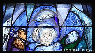 God, the Creator of all life, detail of stained glass window in church of Saint John in Piflas, Germany Editorial Stock Photo