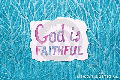 God is faithful - watercolor christian lettering, motivational biblical phrase on blue background Stock Photo