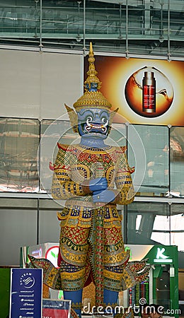 God statue at Suvarnabhumi Airport interior Editorial Stock Photo