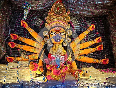 Goddess Durga idol made of used and recycle plastic bottles with pollution free mask on mouth Stock Photo