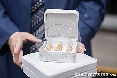 Godmother holding wedding coins Stock Photo