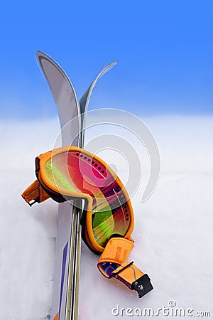 Goggles in Snow with Skis Stock Photo