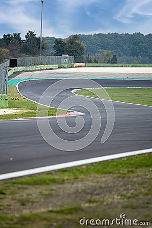 Going towards double turn motorsport circuit asphalt track Editorial Stock Photo