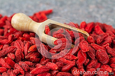Goji berries close-up. Scoop with dried gougizi berries, selective focus Stock Photo