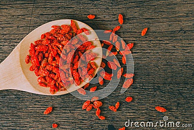 Goji berries on wood Herbal healthy food, source of vitamin C Stock Photo