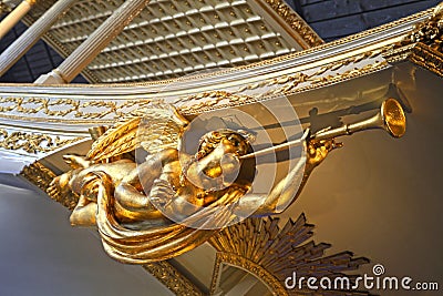 Gold angel statue on baroque ship Stock Photo