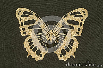 Gold applique in the form of a butterfly Stock Photo