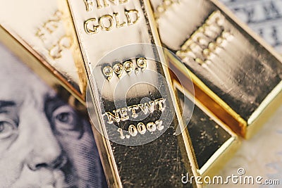 Gold bar, bullions or ingot stack on america US dollar banknote Stock Photo