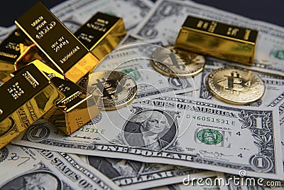 Gold bars and american one dollar bills. Scattered bitcoin digital cryptocurrency coin. Editorial Stock Photo