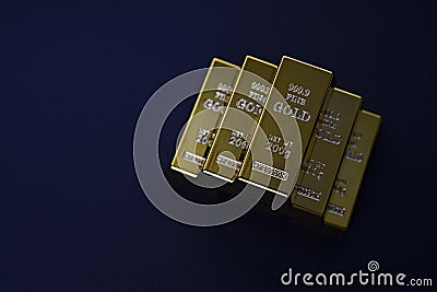 gold bars stacked in a pyramid shape. Shiny precious metals for investments or reserves. Stock Photo