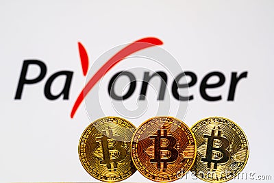 Gold Bitcoin coins with the Payoneer logo Editorial Stock Photo