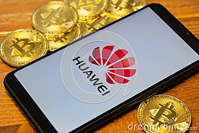 Gold Bitcoin Coins pile with the Huawei logo Editorial Stock Photo