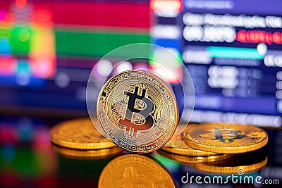 Gold Bitcoin crypto currency on background of dawn chart diagram depreciation Stock Photo