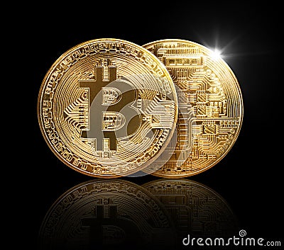 Gold bitcoin physical on black background with reflecti Stock Photo