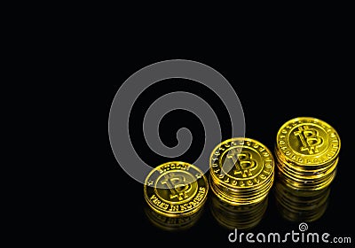 Gold Bitcoin stack on black background. Stock Photo