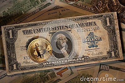 Gold Bitcoin on top of antique on Dollar banknote. Silver Certificate Dollar Stock Photo