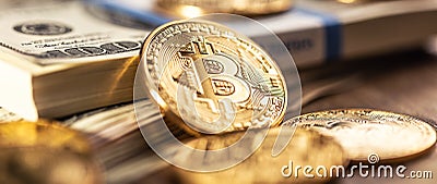 Gold Bitcoins on American Banknotes Stock Photo