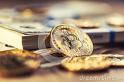 Gold Bitcoins on American Banknotes Stock Photo