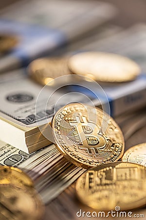 Gold Bitcoins on American Banknotes Stock Photo