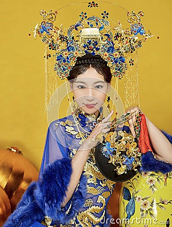 Gold And Blue ancient clothes In China Editorial Stock Photo