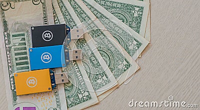 Bitcoin USB miners on top of American money Stock Photo
