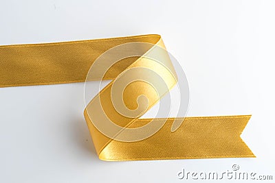 gold bow ribbon satin texture isolated on white Stock Photo