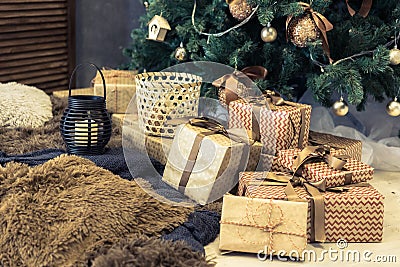 Gold boxes with gifts under the Christmas tree Stock Photo