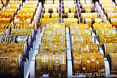 Gold bracelets in the display window of a jewelleries store in gold bazaar Stock Photo