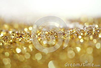 Gold bronze glitter shine dots confetti. Abstract light blink sparkle defocus backgound Stock Photo