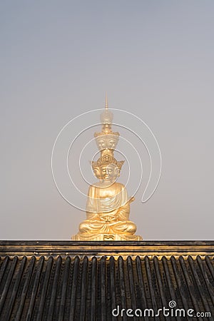 Gold buddha closeup on foggy background Stock Photo